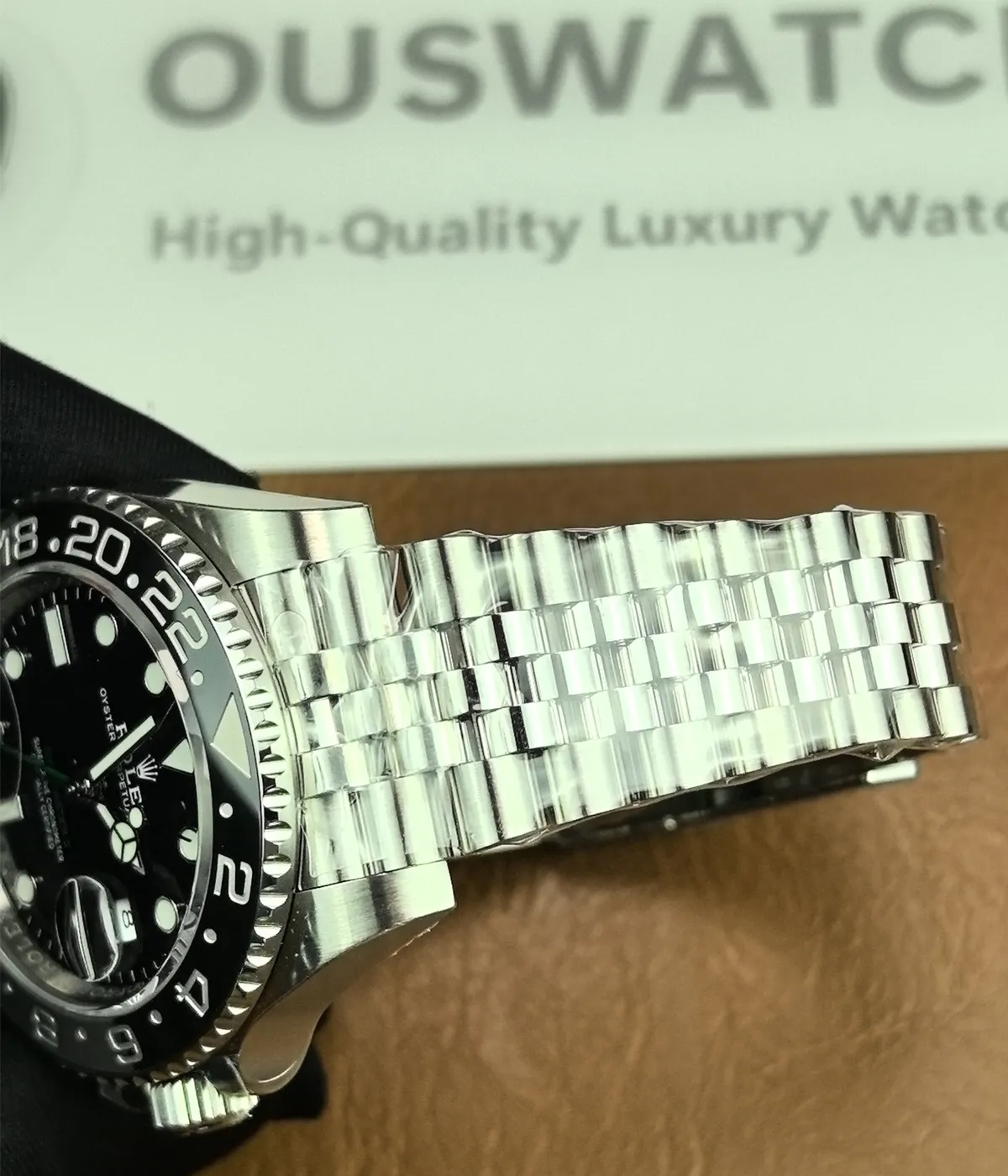 Detailed view of the bracelet on the Rolex Bruce Wayne GMT Master II 126710GRNR 40mm men's watch.