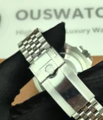 Close-up view of the clasp on the Rolex Bruce Wayne GMT Master II 126710GRNR 40mm men's watch.