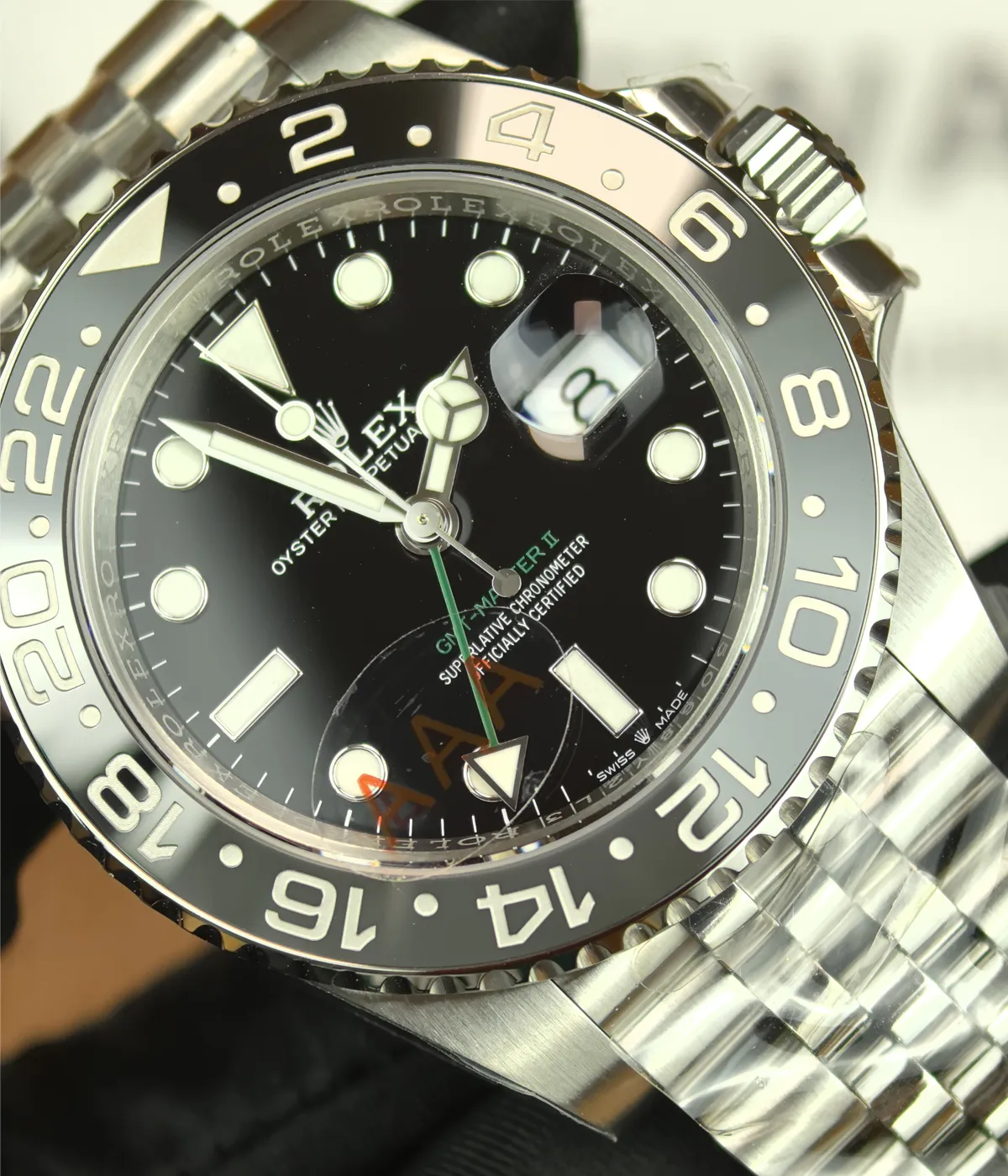 Close-up of the dial and bezel details on the Rolex Bruce Wayne GMT Master II 126710GRNR 40mm men's watch.
