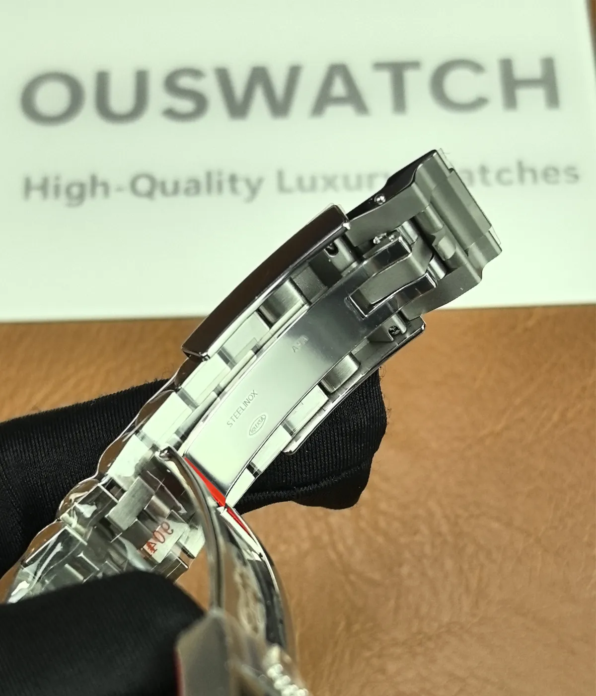 Close-up of the inner side of the clasp on the Rolex Bruce Wayne GMT Master II 126710GRNR 40mm men's watch.