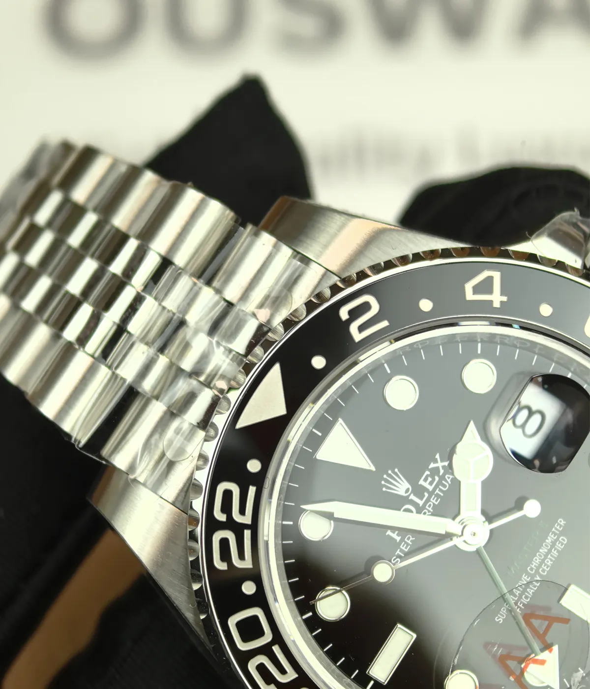 Close-up of the lugs on the Rolex Bruce Wayne GMT Master II 126710GRNR 40mm men's watch.