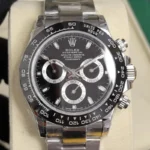 Front view of the Rolex Cosmograph Daytona 116500LN-0002 40mm men's watch with a black dial and ceramic bezel, featuring a stainless steel Oyster bracelet.
