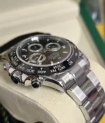 -25-degree angle view of the Rolex Cosmograph Daytona 116500LN-0002 40mm men's watch, featuring a black dial and ceramic bezel.