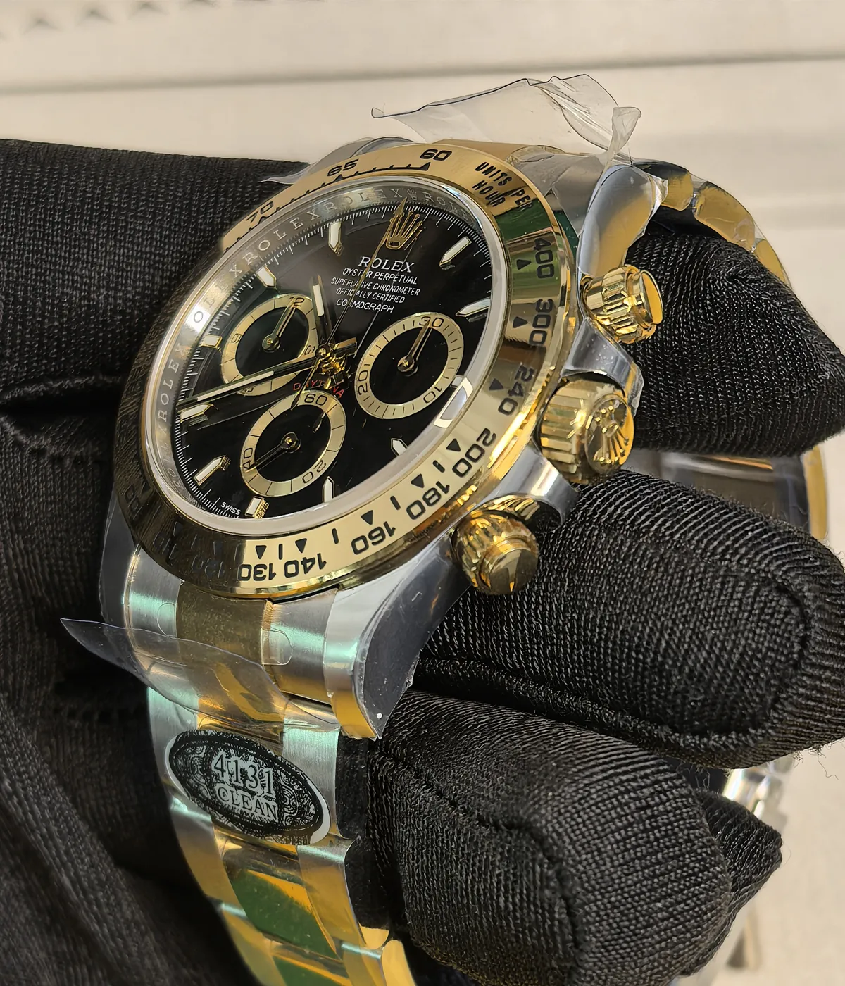 Close-up of the gold dial and lugs on the Rolex Cosmograph Daytona Yellow Rolesor M126503 men's watch.