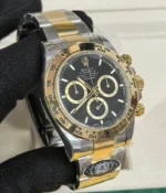 The Rolex Cosmograph Daytona Yellow Rolesor M126503 men's watch being worn on the wrist.
