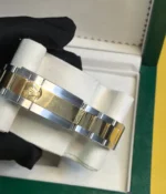 Close-up of the clasp on the Rolex Cosmograph Daytona Yellow Rolesor M126503 men's watch.