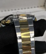 Close-up view of the gold and steel bracelet on the Rolex Cosmograph Daytona Yellow Rolesor M126503 men's watch.