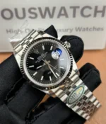 -45-degree angle view of the Rolex Datejust 36mm M126234-0015 with a black dial, two-tone case, and Oyster strap.