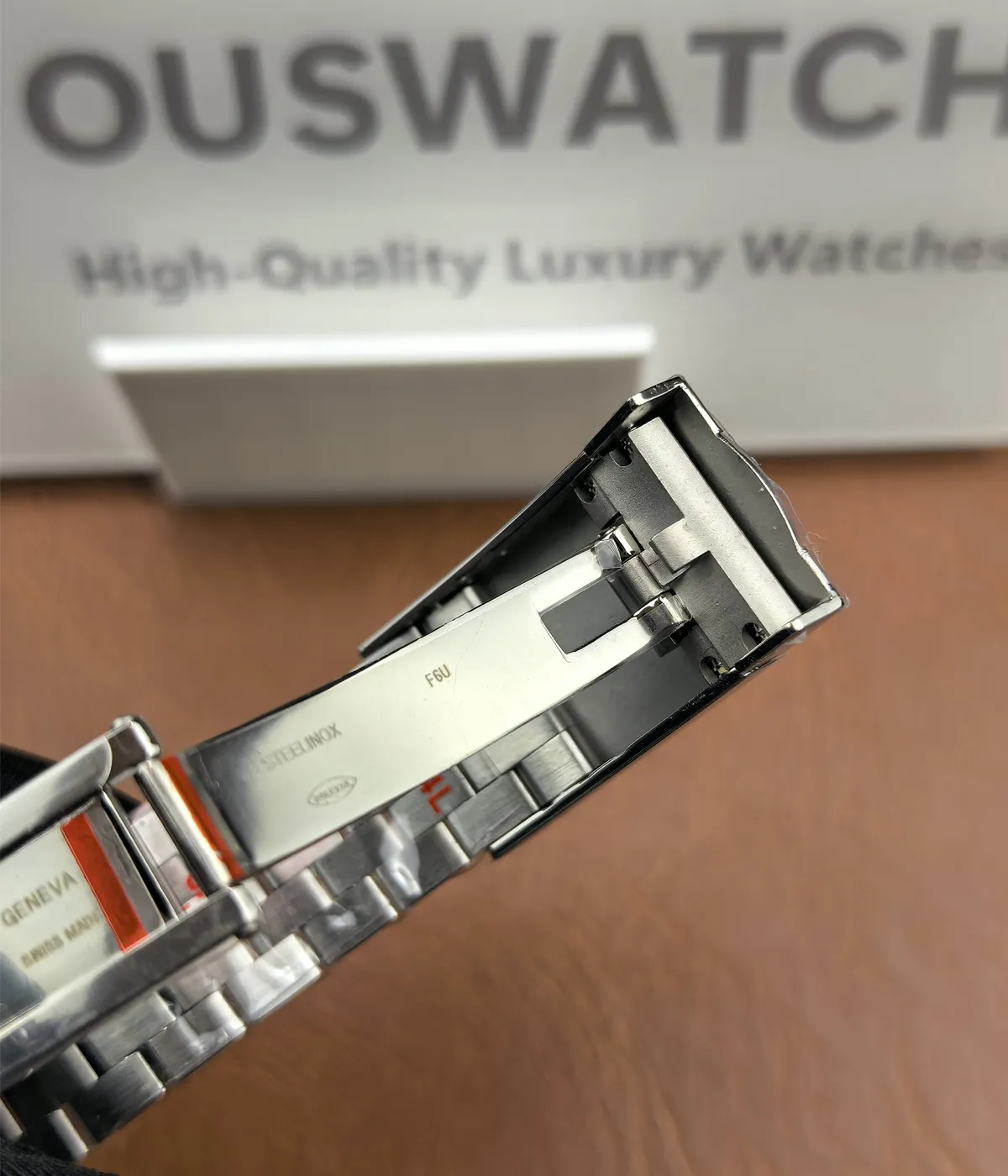 Detailed close-up of the clasp on the Rolex Datejust 36mm M126234-0015 with a two-tone Oyster strap.