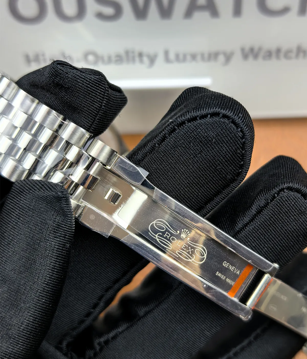 Close-up of the inner logo on the clasp of the Rolex Datejust 36mm M126234-0015 with a two-tone Oyster strap.