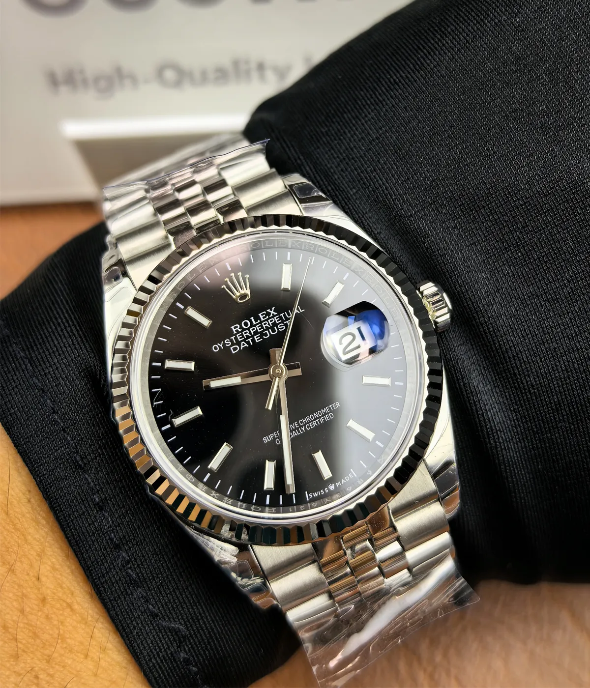 The Rolex Datejust 36mm M126234-0015 with a black dial and two-tone Oyster strap being worn on the wrist.
