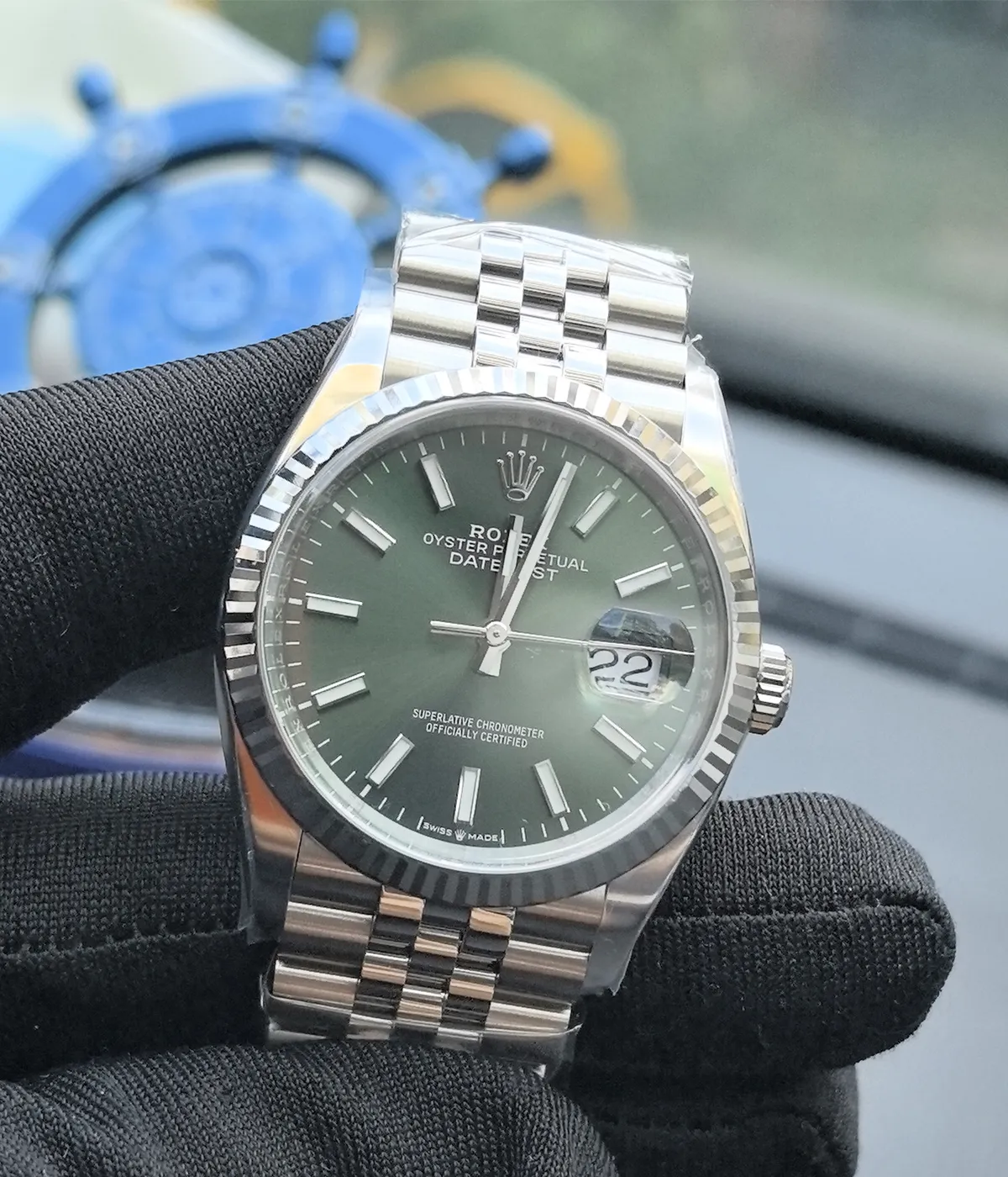 15-degree angle view of the Rolex Datejust 36mm M126234-0051 with a mint olive green dial, two-tone case, and Oyster strap.