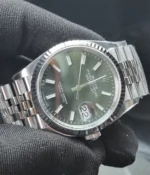 45-degree angle view of the Rolex Datejust 36mm M126234-0051 with a mint olive green dial, two-tone case, and Oyster strap.