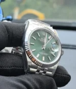 Close-up of the bezel on the Rolex Datejust 36mm M126234-0051 with a mint olive green dial and two-tone case.