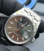 Close-up of the dial and lugs on the Rolex Datejust 36mm M126234-0051 with a mint olive green dial and two-tone case.