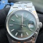 Front view of the Rolex Datejust 36mm M126234-0051 with a mint olive green dial, two-tone case, and Oyster strap.