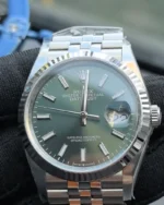 Front view of the Rolex Datejust 36mm M126234-0051 with a mint olive green dial, two-tone case, and Oyster strap.