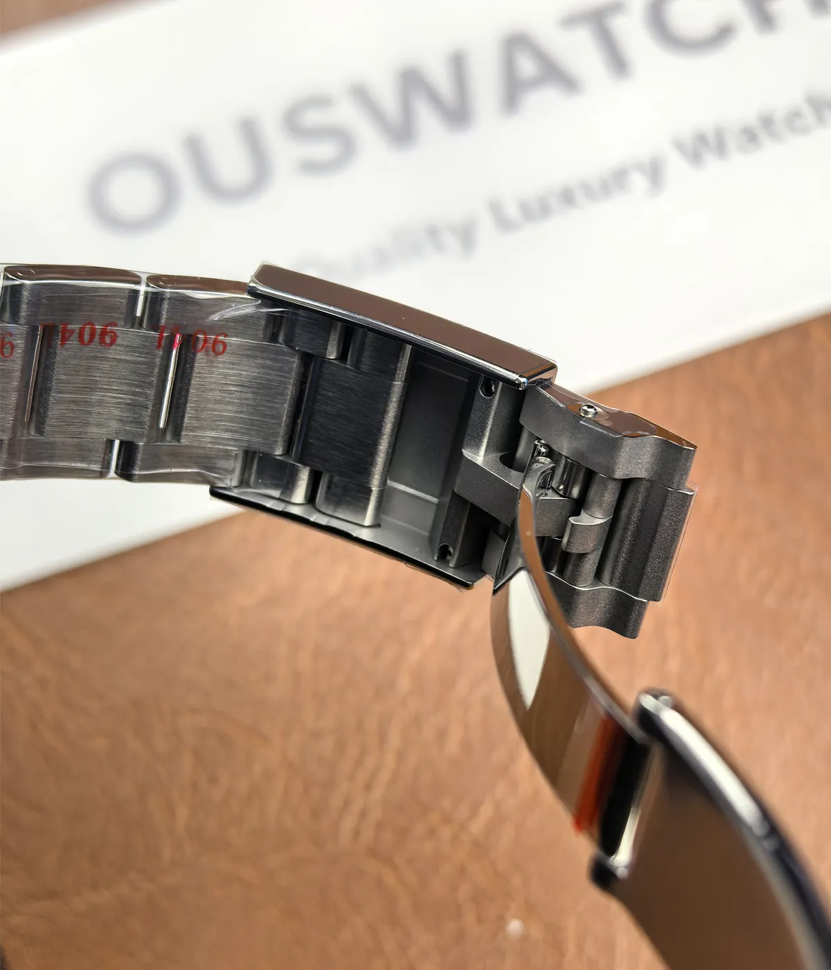 Close-up view of the clasp and bracelet on the Rolex Daytona 116500LN-0001 "Panda" 40mm watch.