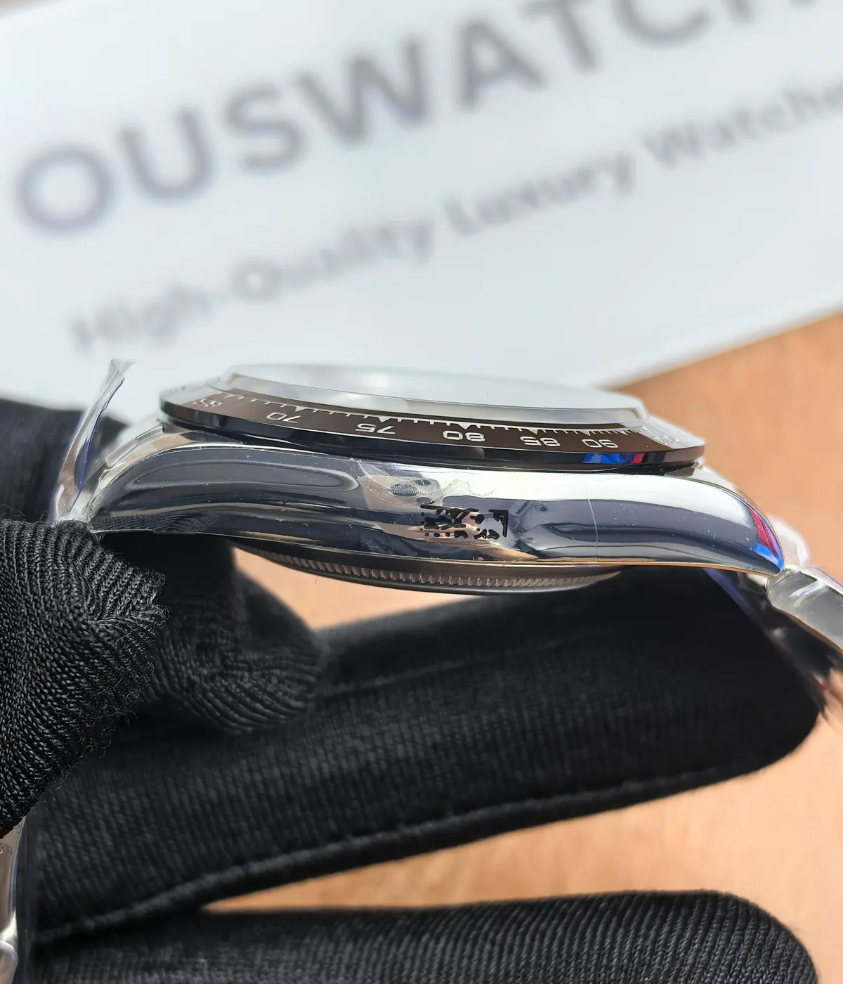 Side view of the Rolex Daytona 116500LN-0001 "Panda" 40mm watch, showcasing the satin finish of the case.