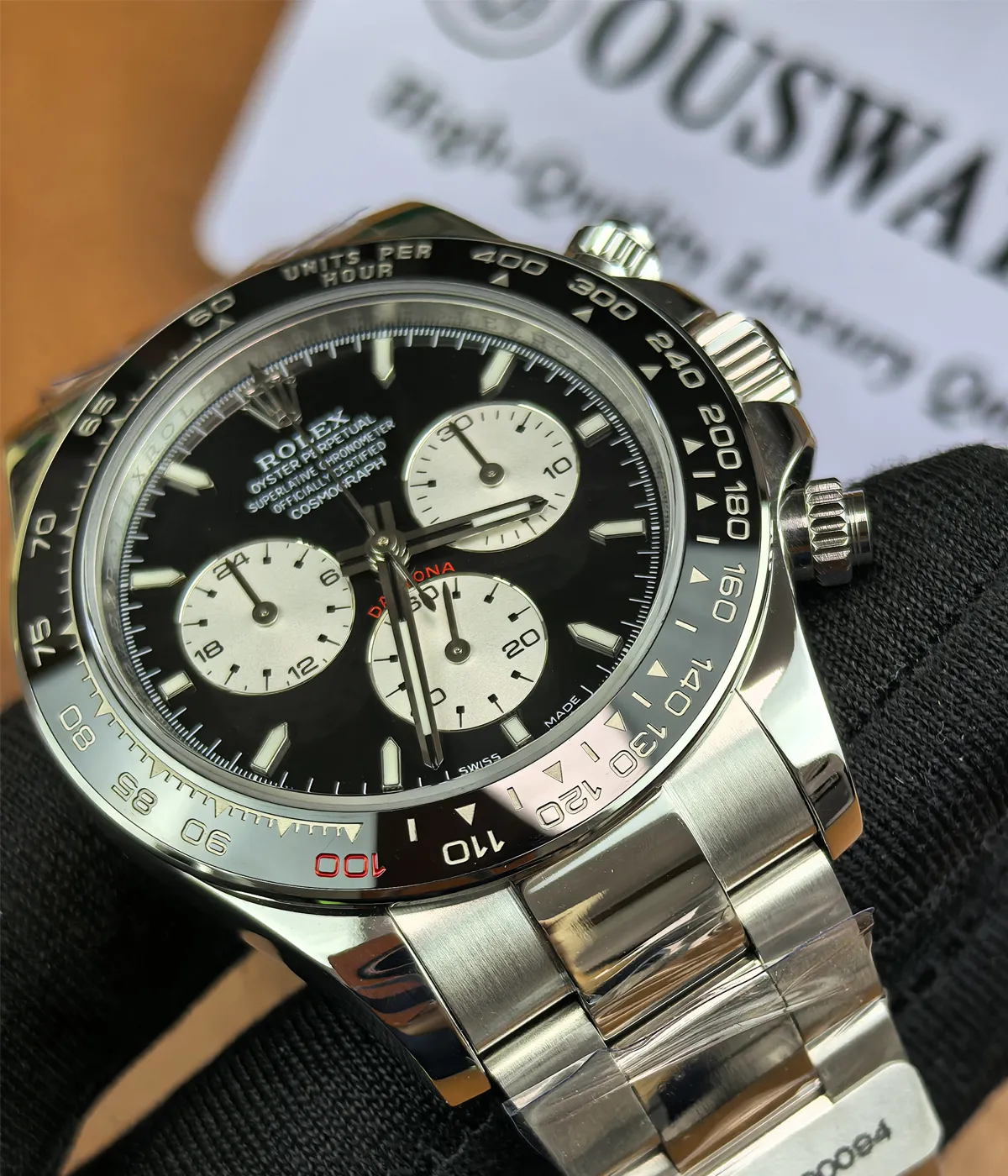 Close-up of the ceramic dial on the Rolex Daytona Le Mans 126529LN White Gold men's watch with black luminous dial.