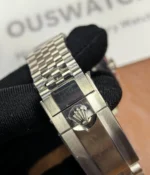 Close-up of the clasp on the Rolex GMT-Master Blue M126710BLNR-0002 with a black dial and Oystersteel case.