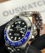 Close-up of the crown on the Rolex GMT-Master Blue M126710BLNR-0002 with a black dial and Oystersteel case.