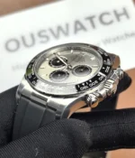 Close-up of the ceramic bezel on the Rolex Ghost Oysterflex Daytona 126519LN with a silver dial.