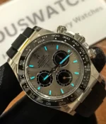 Luminous display of the Rolex Ghost Oysterflex Daytona 126519LN in the dark, showcasing its dial and hands.