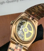 Close-up of the movement inside the Rolex Land-Dweller 127335-0001 with a rose gold case.