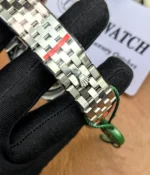 Full view of the bracelet on the Rolex Land-Dweller 127336-0001 with a platinum case and triangular grooved bezel.