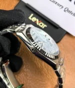 Side view showcasing the satin finish and triangular grooved bezel of the Rolex Land-Dweller 127336-0001 with a platinum case.