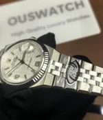 Full view of the bracelet on the Rolex Land-Dweller 127334-0001 with a platinum case and triangular grooved bezel.