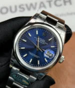 25-degree angle view of the Rolex M276200-0006 28mm with a blue dial and Oyster steel strap.