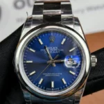 Front view of the Rolex M276200-0006 28mm with a blue dial and Oyster steel strap.