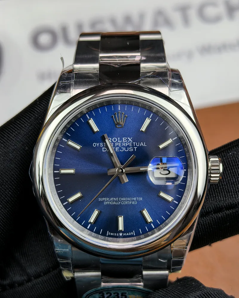 Front view of the Rolex M276200-0006 28mm with a blue dial and Oyster steel strap.