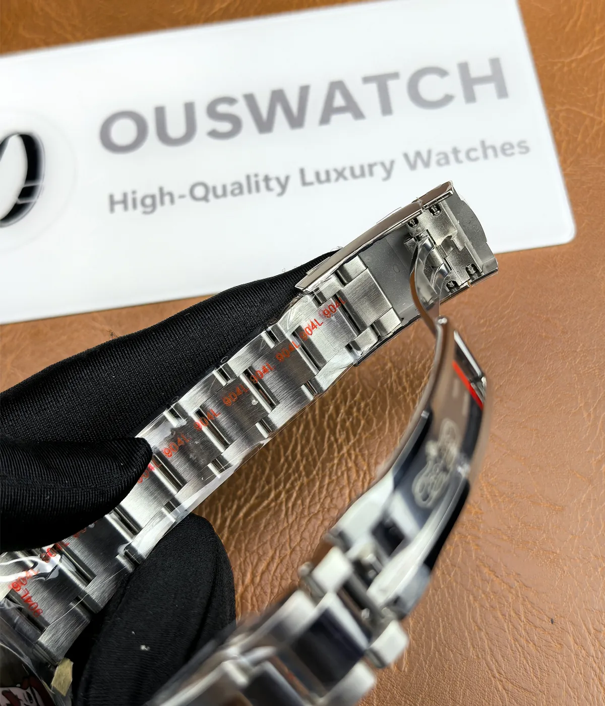 Close-up view of the inner details of the steel links on the Rolex M276200-0006 28mm with a blue dial and Oyster steel strap.