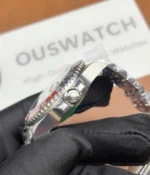 Close-up of the crown on the Rolex Pepsi GMT-Master II M126719BLRO-0001 with a black dial and white gold case.