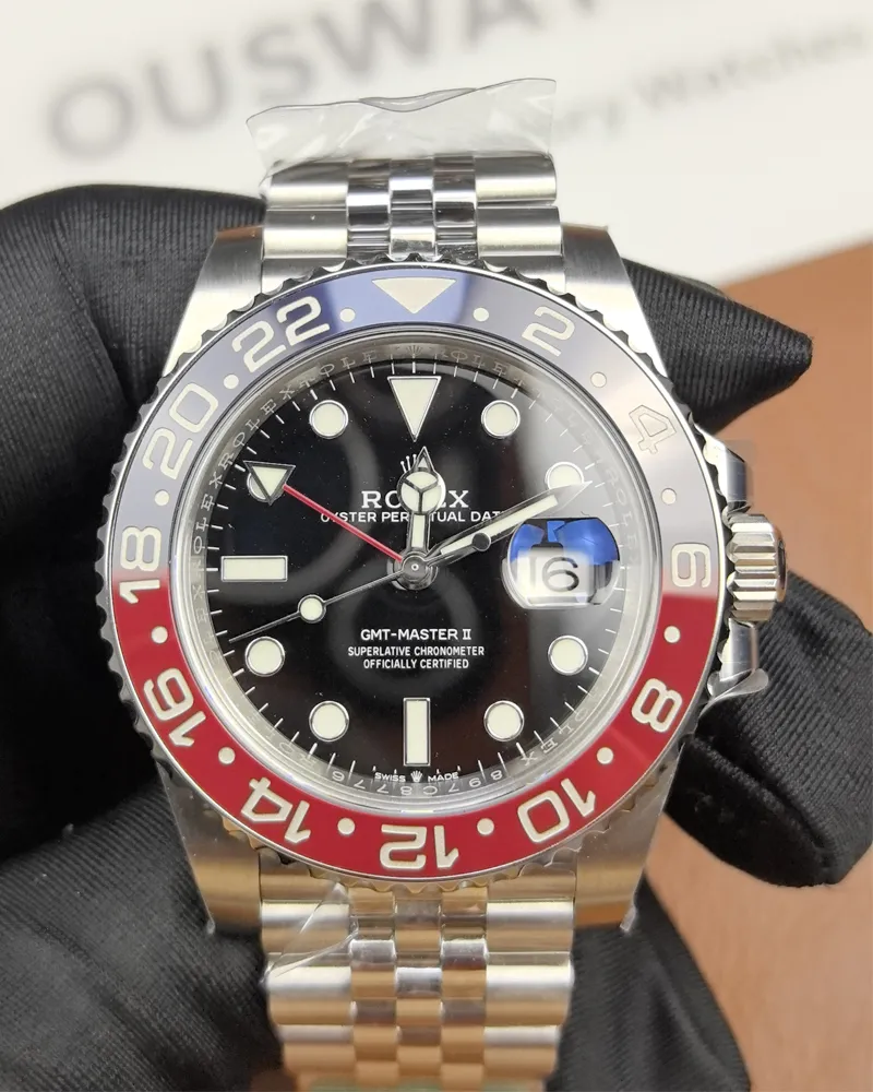 Front view of the Rolex Pepsi GMT-Master II M126719BLRO-0001 with a black dial and white gold case.