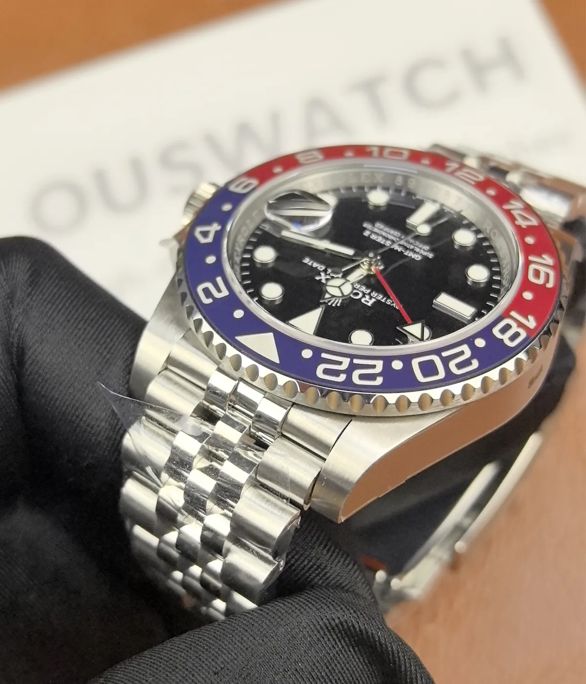 Close-up of the lugs on the Rolex Pepsi GMT-Master II M126719BLRO-0001 with a black dial and white gold case.