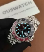 Luminous display of the Rolex Pepsi GMT-Master II M126719BLRO-0001 with a black dial and white gold case in the dark.