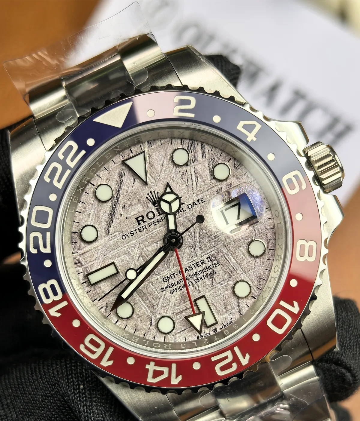 Close-up of the dial and bezel on the Rolex Pepsi Meteorite Dial GMT-Master II M126719BLRO-0002 with a white gold case.