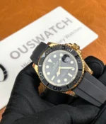 -45-degree angle view of the Rolex Rose Gold Yachtmaster 126655-0002 with a black dial and rubber strap.