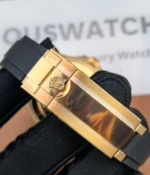 Close-up of the clasp on the Rolex Rose Gold Yachtmaster 126655-0002 with a black dial and rubber strap.