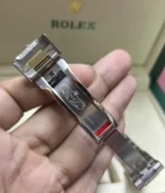 Close-up of the clasp on the Rolex Sea Dweller M126603-0001 with a black dial and Oystersteel and yellow gold two-tone case.