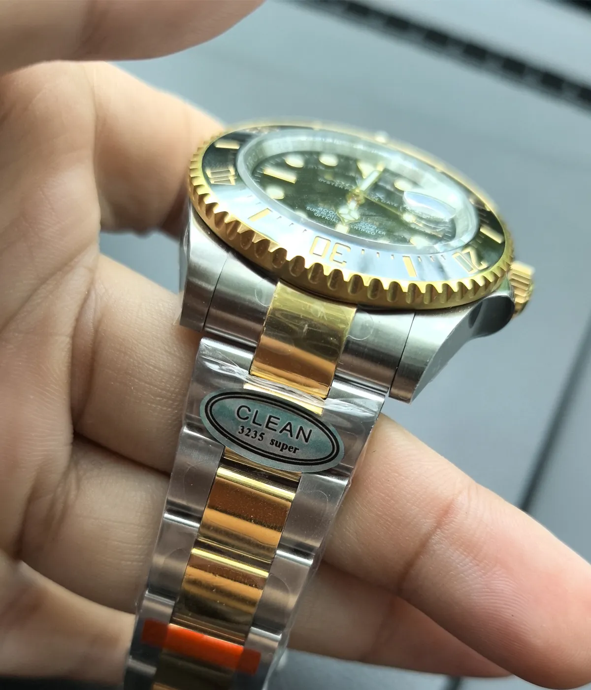 Close-up view of the lugs on the Rolex Sea Dweller M126603-0001 with a black dial and Oystersteel and yellow gold two-tone case.