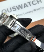 Close-up of the clasp on the Rolex Submariner Date 116610LV-0002 with a 40MM green dial and Oystersteel case.