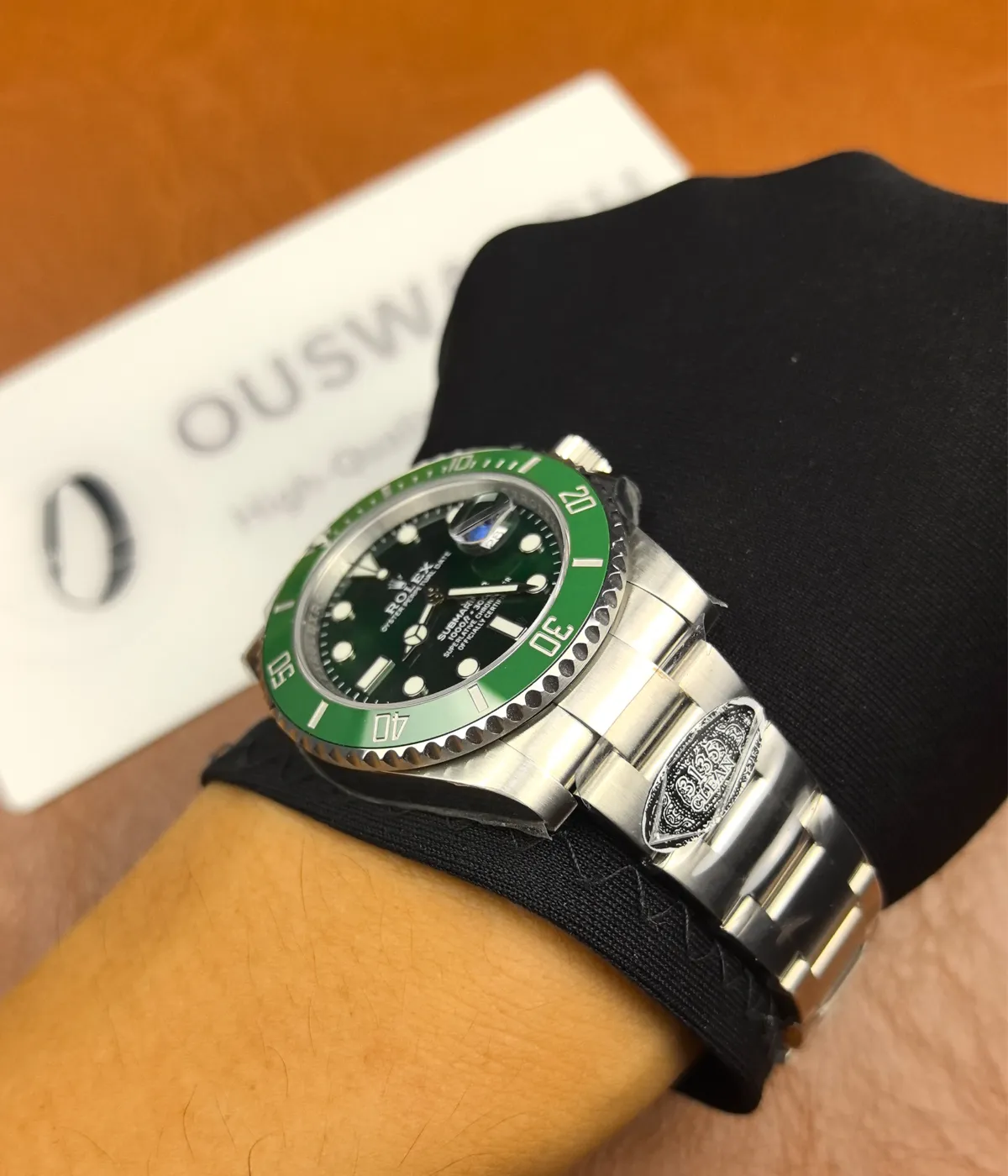 The Rolex Submariner Date 116610LV-0002 with a 40MM green dial and Oystersteel case being worn on the wrist.