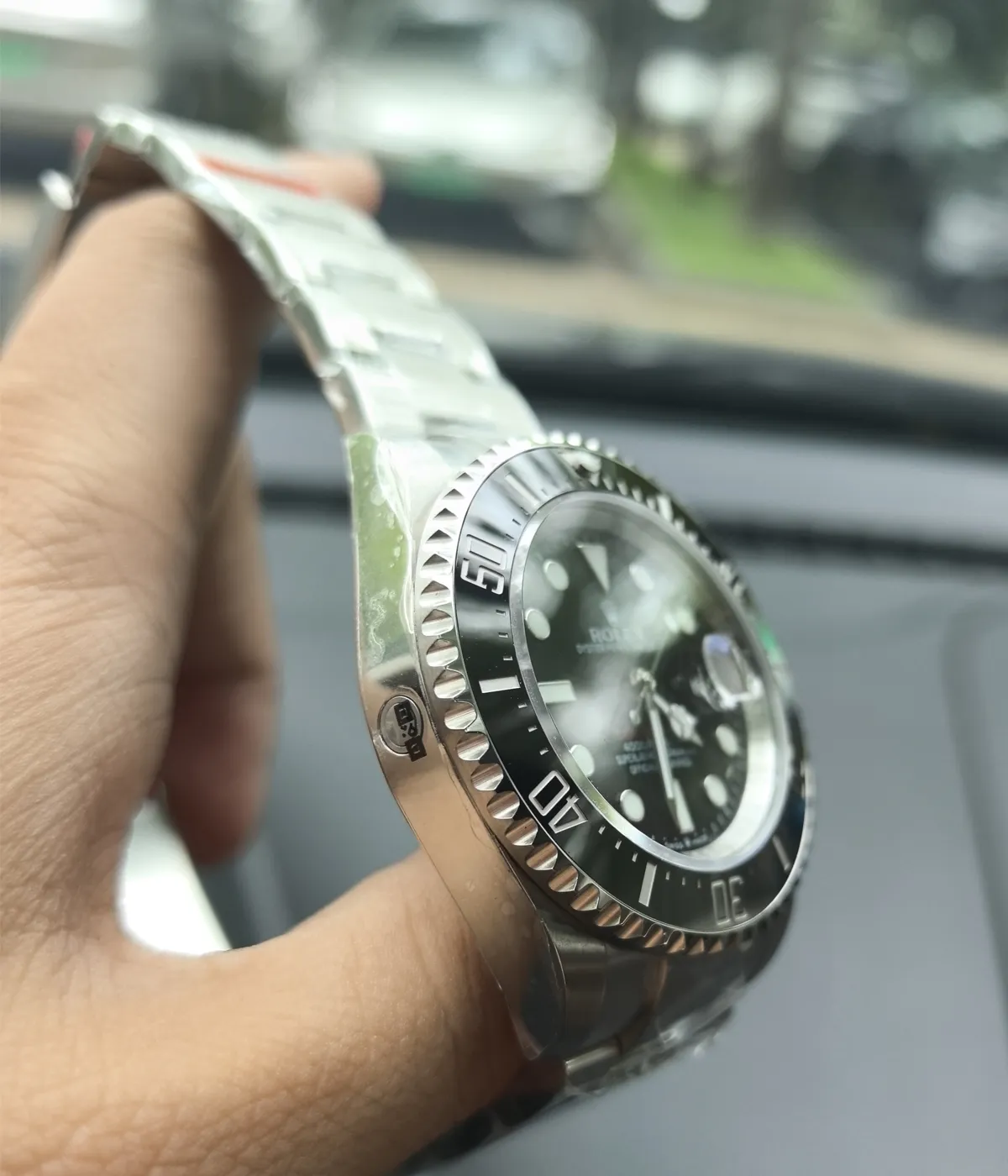 Close-up of the ceramic bezel on the Rolex Submariner Date 126610LN 41MM with a black dial and Oystersteel case.