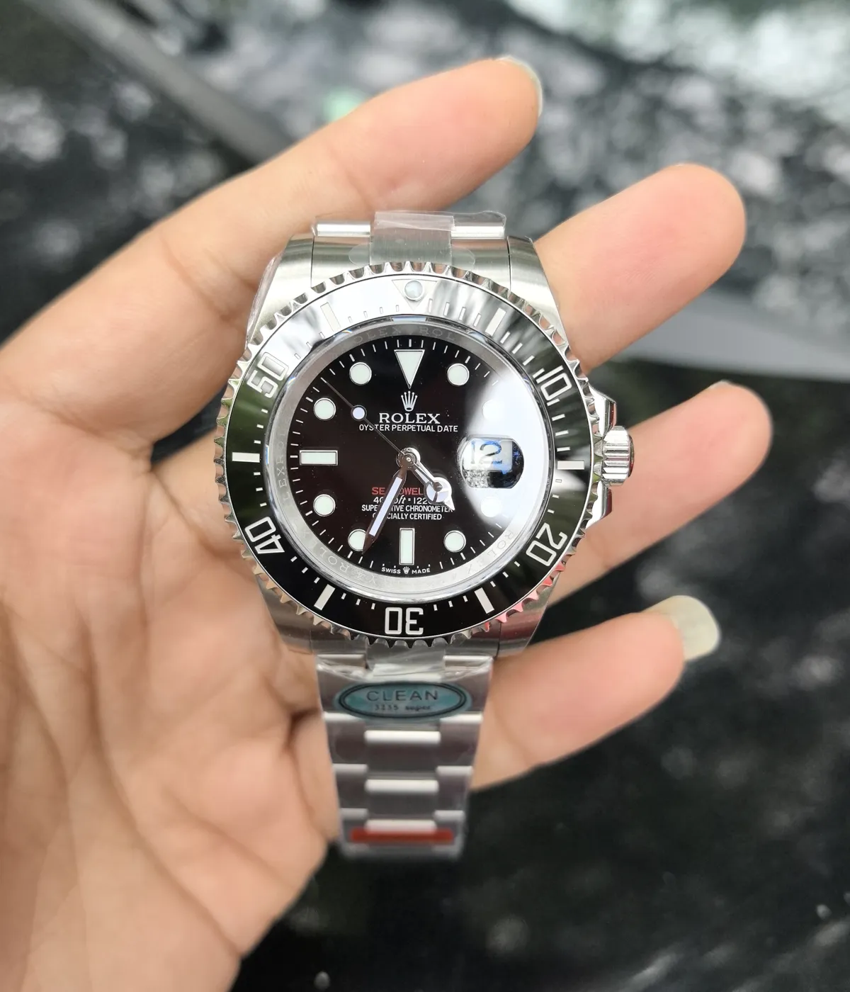 Close-up of the dial and bezel details on the Rolex Submariner Date 126610LN 41MM with a black dial and ceramic bezel.