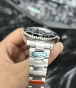 Close-up of the lugs and bracelet on the Rolex Submariner Date 126610LN 41MM with a black dial and ceramic bezel.